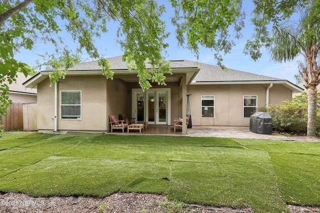 716 Hazelmoor Ln, Ponte Vedra, FL 32081 - rear view of house with a lawn, stucco siding, and french doors