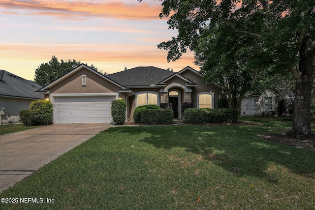 716 Hazelmoor Ln, Ponte Vedra, FL 32081 - ranch-style house featuring a garage, driveway, stucco siding, a shingled roof, and a yard