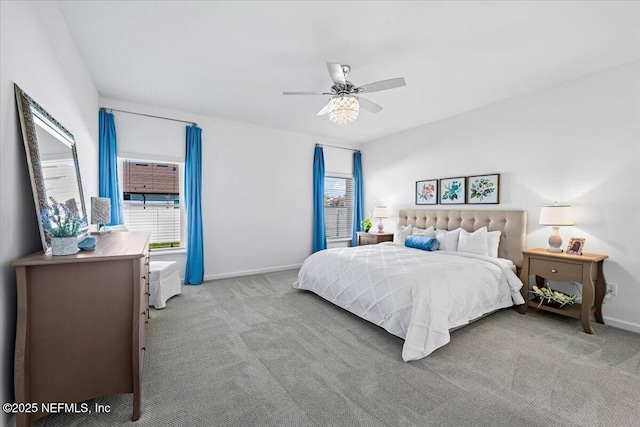carpeted bedroom featuring ceiling fan and baseboards