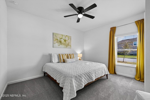 carpeted bedroom featuring baseboards and ceiling fan