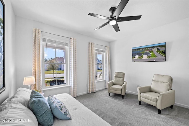 bedroom with baseboards, a ceiling fan, and carpet