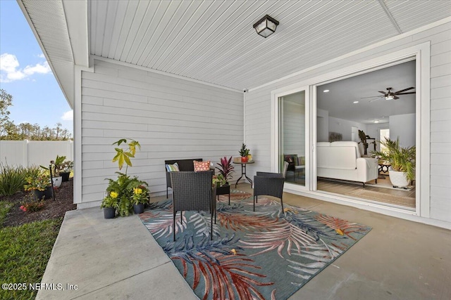 view of patio / terrace featuring fence