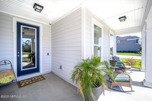 entrance to property featuring covered porch