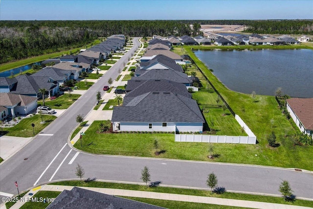 aerial view with a water view and a residential view