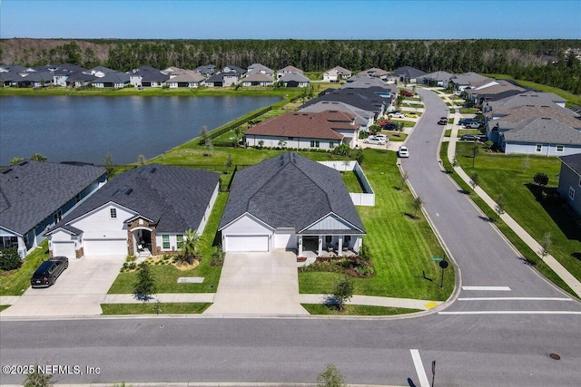 aerial view featuring a residential view and a water view