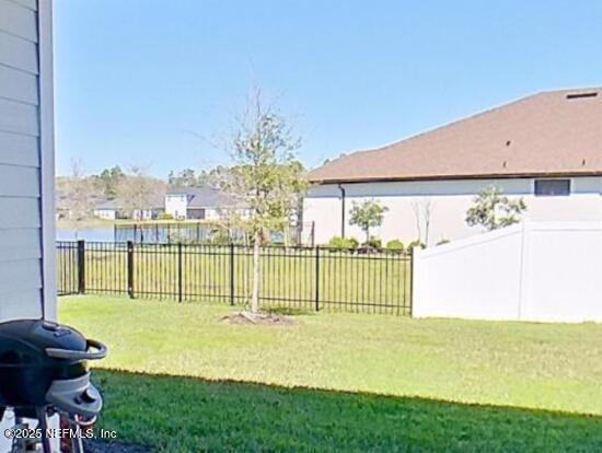 view of yard with a fenced backyard