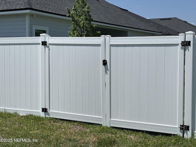 view of gate featuring fence