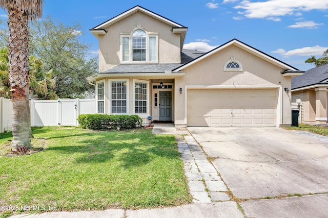 traditional home featuring fence, concrete driveway, an attached garage, stucco siding, and a front lawn