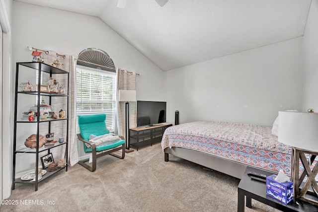 carpeted bedroom with ceiling fan and lofted ceiling