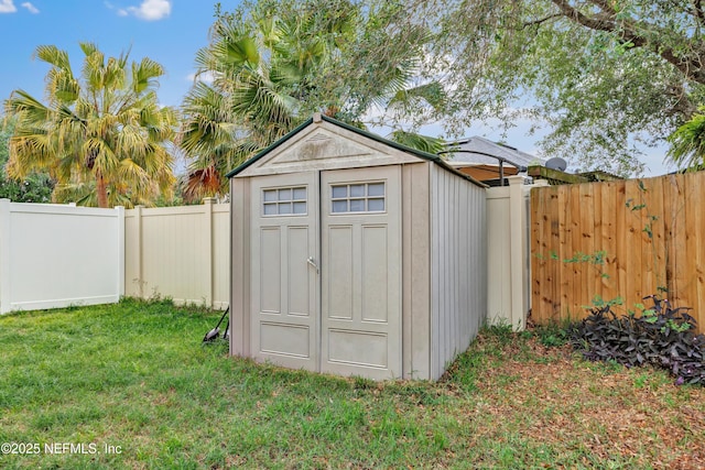 view of shed featuring a fenced backyard