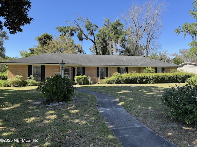 3715 Rustic Ln, Jacksonville, FL 32217 - ranch-style home featuring brick siding and a front yard