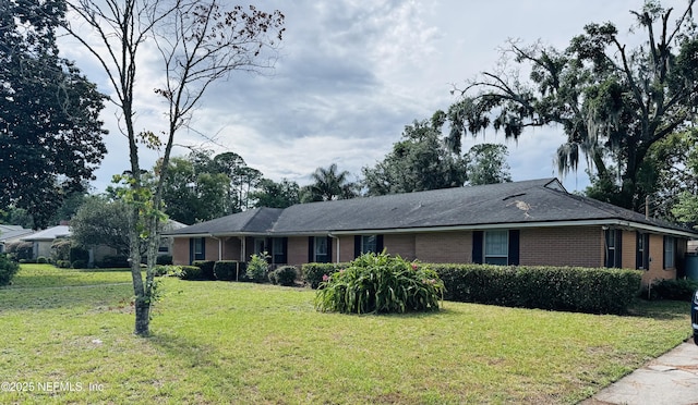 3715 Rustic Ln, Jacksonville, FL 32217 - single story home featuring brick siding and a front yard