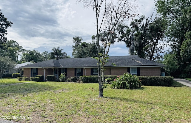 3715 Rustic Ln, Jacksonville, FL 32217 - ranch-style home featuring brick siding and a front yard