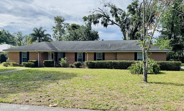 3715 Rustic Ln, Jacksonville, FL 32217 - single story home with brick siding and a front yard