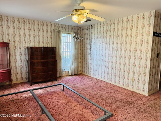 3715 Rustic Ln, Jacksonville, FL 32217 - spare room with a ceiling fan, carpet, a chandelier, and baseboards