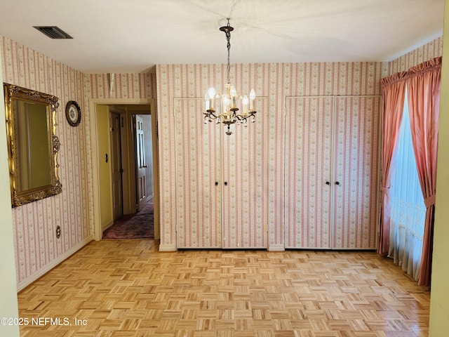 3715 Rustic Ln, Jacksonville, FL 32217 - unfurnished dining area featuring a chandelier and baseboards