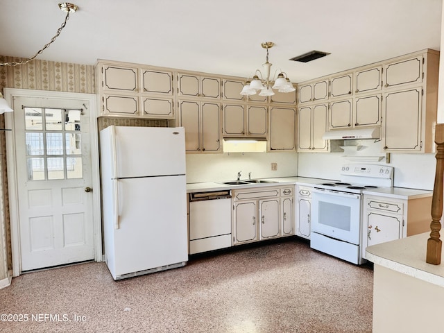 3715 Rustic Ln, Jacksonville, FL 32217 - kitchen with white appliances, under cabinet range hood, a sink, a chandelier, and light countertops