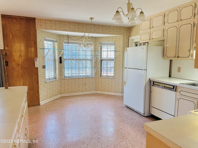 3715 Rustic Ln, Jacksonville, FL 32217 - kitchen featuring white appliances, wallpapered walls, a chandelier, baseboards, and light countertops