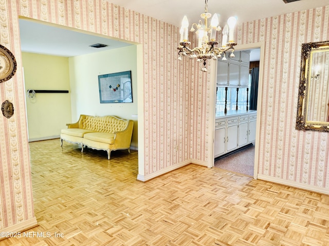 3715 Rustic Ln, Jacksonville, FL 32217 - dining space with a chandelier, baseboards, and wallpapered walls