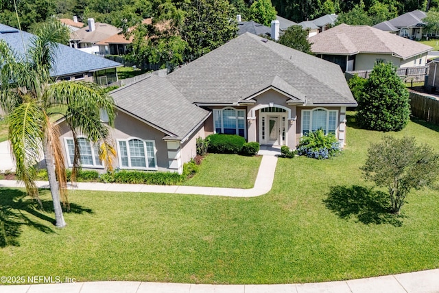 3099 Five Oaks Ln, Green Cove Springs, FL 32043 - single story home with a shingled roof, stucco siding, and a residential view