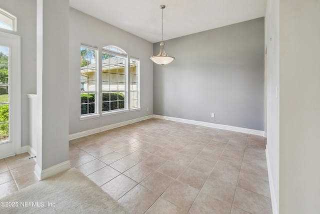 3099 Five Oaks Ln, Green Cove Springs, FL 32043 - unfurnished dining area with tile patterned floors and baseboards