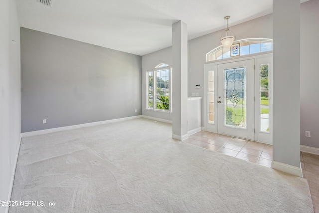 3099 Five Oaks Ln, Green Cove Springs, FL 32043 - carpeted foyer entrance with healthy amount of natural light, baseboards, and tile patterned flooring