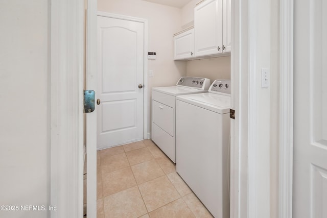 3099 Five Oaks Ln, Green Cove Springs, FL 32043 - laundry area featuring independent washer and dryer, cabinet space, and light tile patterned floors