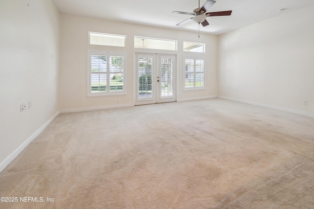 3099 Five Oaks Ln, Green Cove Springs, FL 32043 - empty room with ceiling fan, plenty of natural light, carpet flooring, and baseboards