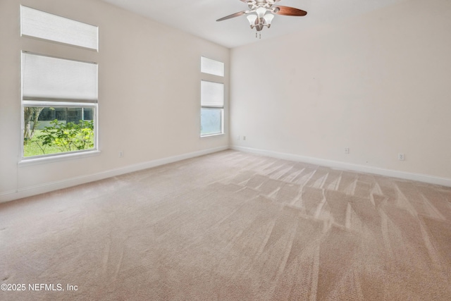 3099 Five Oaks Ln, Green Cove Springs, FL 32043 - unfurnished room with light carpet, a ceiling fan, and baseboards