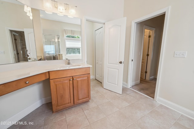 3099 Five Oaks Ln, Green Cove Springs, FL 32043 - full bath featuring tile patterned floors, vanity, a stall shower, and baseboards