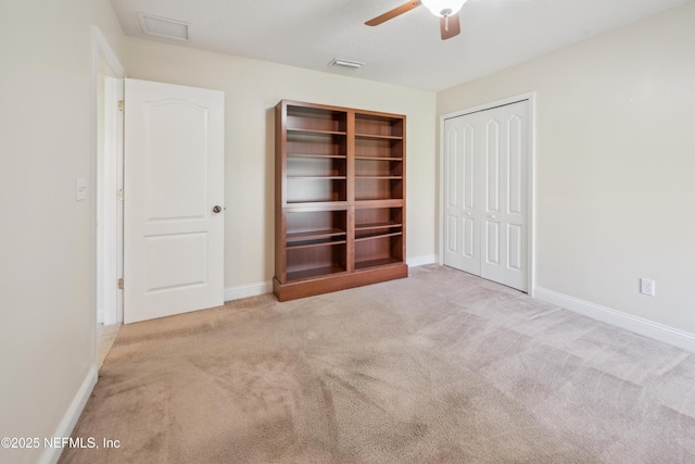 3099 Five Oaks Ln, Green Cove Springs, FL 32043 - unfurnished bedroom featuring carpet floors, a closet, baseboards, and a ceiling fan