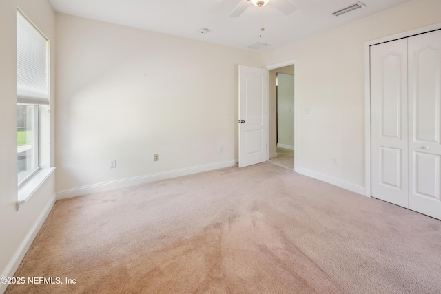 3099 Five Oaks Ln, Green Cove Springs, FL 32043 - unfurnished bedroom featuring carpet floors, a closet, baseboards, and a ceiling fan