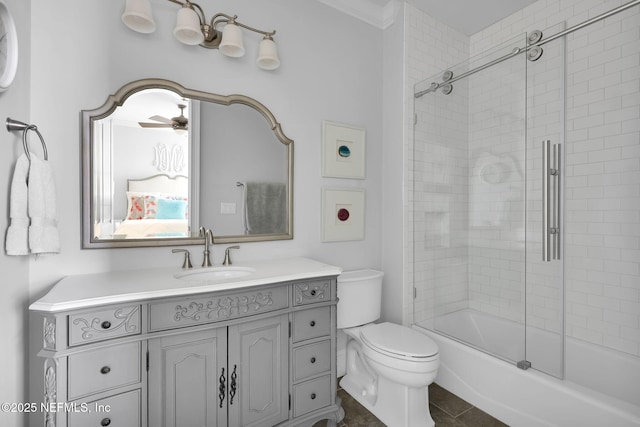 full bathroom featuring vanity, toilet, and shower / bath combination with glass door