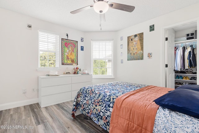 206 Woodland Greens Dr, Ponte Vedra, FL 32081 - bedroom featuring a ceiling fan, light wood-style floors, a textured ceiling, and visible vents