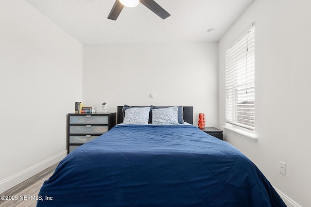 206 Woodland Greens Dr, Ponte Vedra, FL 32081 - bedroom featuring wood finished floors, baseboards, a textured ceiling, and ceiling fan