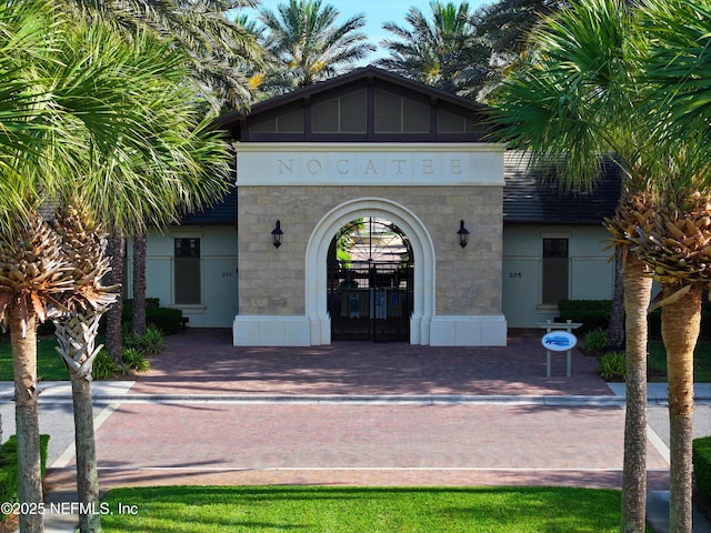 206 Woodland Greens Dr, Ponte Vedra, FL 32081 - property entrance featuring stone siding and stucco siding