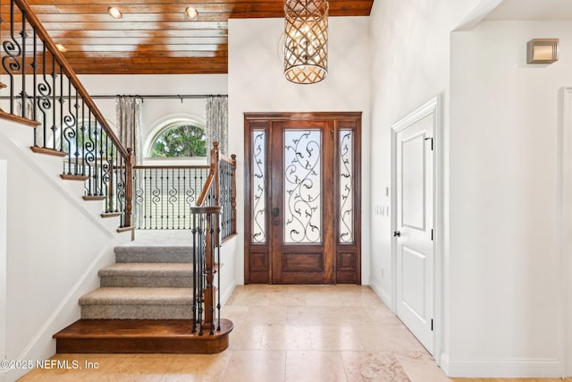 1833 N Lakeshore Dr, Fleming Island, FL 32003 - foyer entrance featuring baseboards, wood ceiling, and stairs