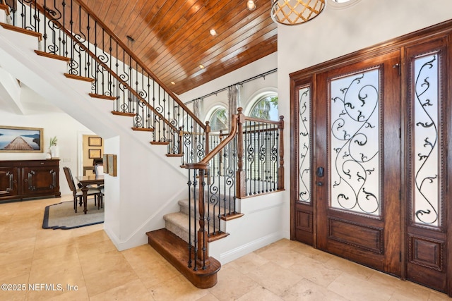 1833 N Lakeshore Dr, Fleming Island, FL 32003 - entryway with wood ceiling, baseboards, and stairs