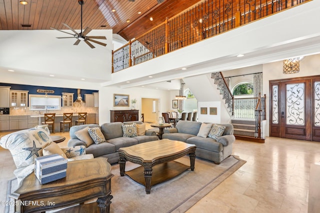 1833 N Lakeshore Dr, Fleming Island, FL 32003 - living room with ceiling fan, high vaulted ceiling, stairs, recessed lighting, and wooden ceiling