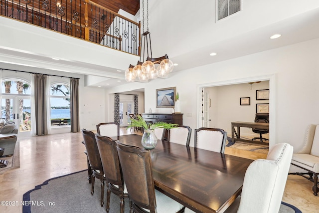 1833 N Lakeshore Dr, Fleming Island, FL 32003 - dining space with a towering ceiling, a notable chandelier, recessed lighting, and visible vents