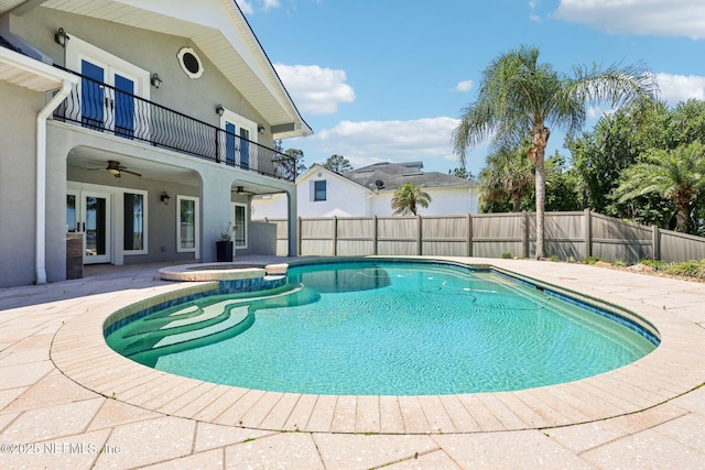 1833 N Lakeshore Dr, Fleming Island, FL 32003 - view of swimming pool with ceiling fan, a patio, a fenced backyard, french doors, and a pool with connected hot tub