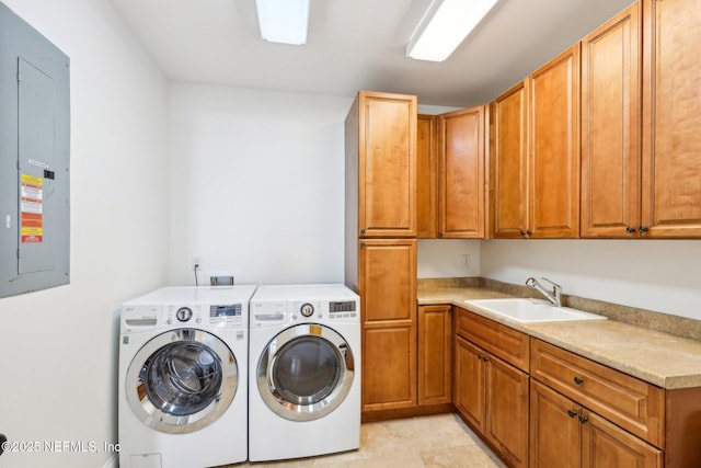 1833 N Lakeshore Dr, Fleming Island, FL 32003 - clothes washing area featuring washing machine and clothes dryer, cabinet space, a sink, and electric panel