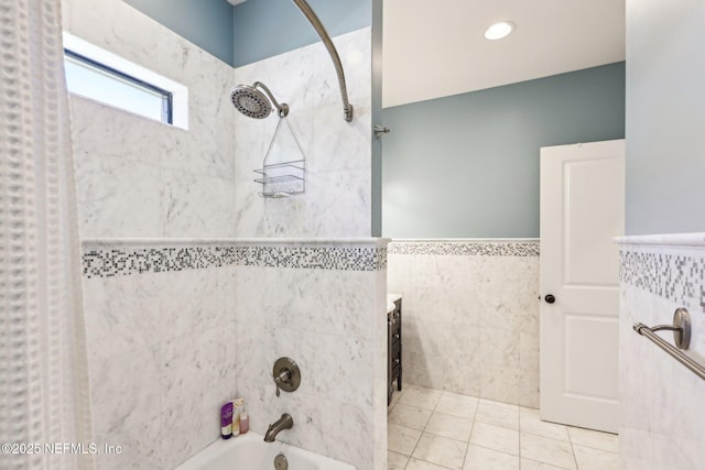 1833 N Lakeshore Dr, Fleming Island, FL 32003 - full bathroom with wainscoting, tile patterned floors, tile walls, and shower / bathtub combination with curtain