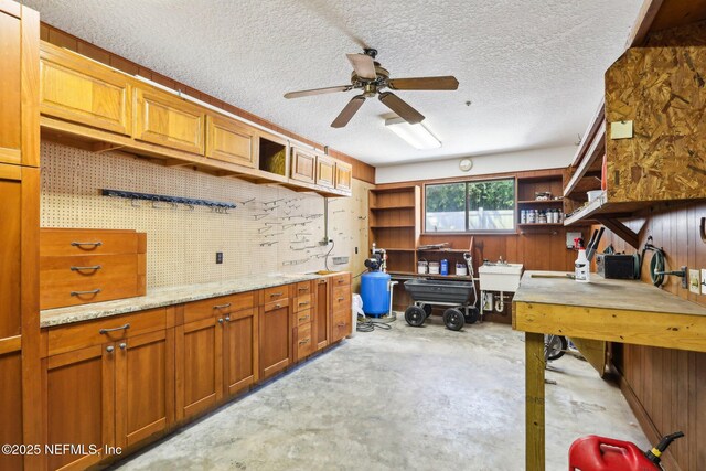 1833 N Lakeshore Dr, Fleming Island, FL 32003 - office with a textured ceiling, unfinished concrete flooring, and ceiling fan