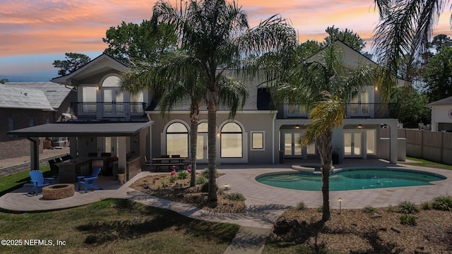 1833 N Lakeshore Dr, Fleming Island, FL 32003 - rear view of property with french doors, an outdoor fire pit, a patio area, and a balcony