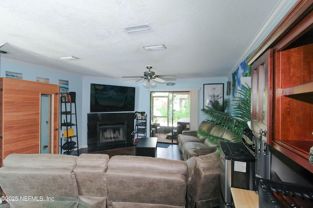 1403 Marsh Cove Ct, Ponte Vedra Beach, FL 32082 - living area with a textured ceiling, ornamental molding, a fireplace, and a ceiling fan