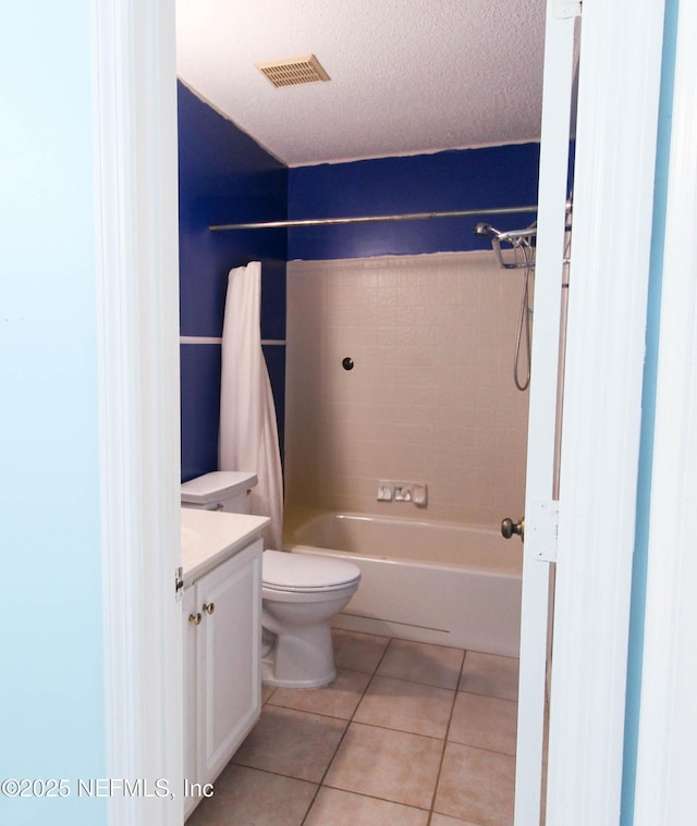 1403 Marsh Cove Ct, Ponte Vedra Beach, FL 32082 - full bathroom featuring tile patterned flooring, vanity, toilet, bathing tub / shower combination, and a textured ceiling