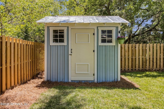 view of shed with a fenced backyard