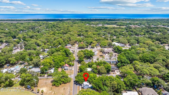 aerial view with a water view, a residential view, and a forest view