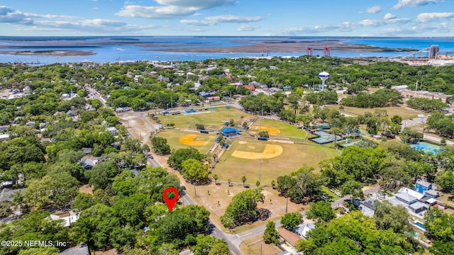 birds eye view of property with a water view